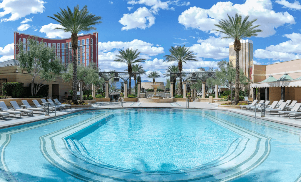 Hyatt and The Venetian Team Up: A Game-Changing Opportunity for Hawai‘i’s Vegas-Bound Travelers Hawaii Calling a pool with palm trees and a building in the background