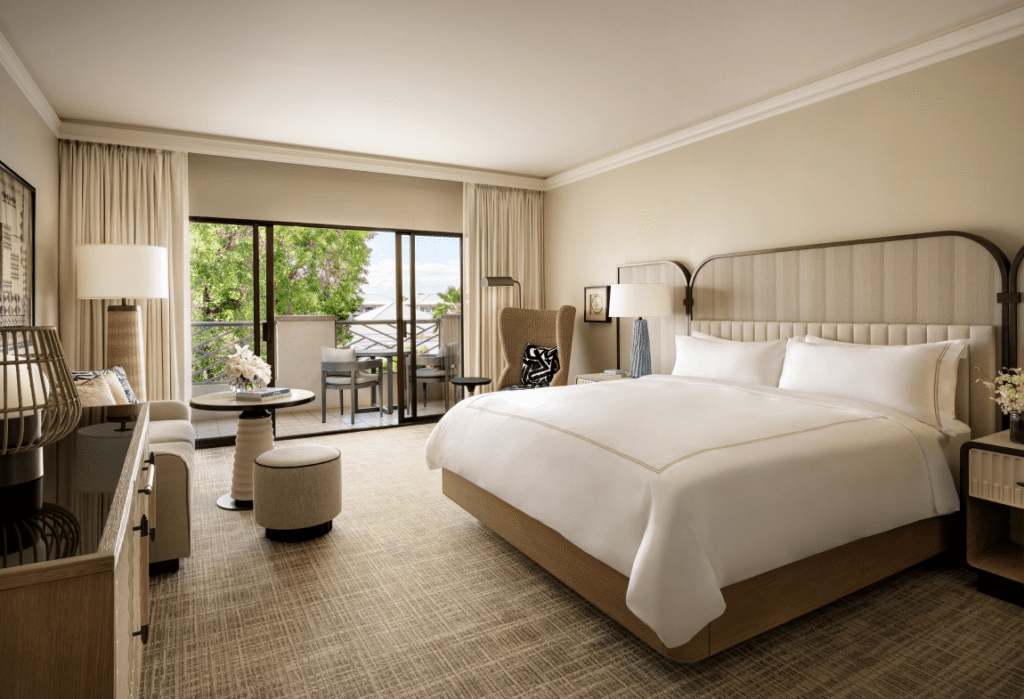 Fairmont Gold Explained: Unlock the Secrets of This Exclusive ‘Hotel Within a Hotel Hawaii Calling a bedroom with a bed and a table and chairs