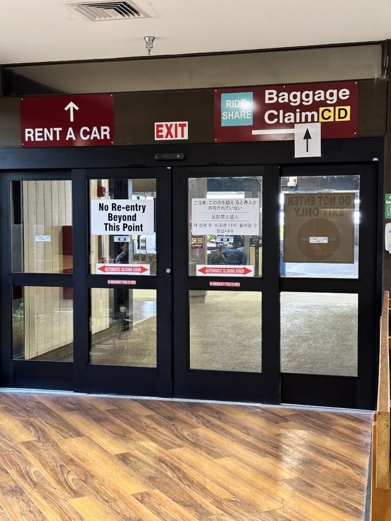 Hilo International Airport Guide (2025) | Big Island Hawai'i (ITO) Hawaii Calling a door with signs on it