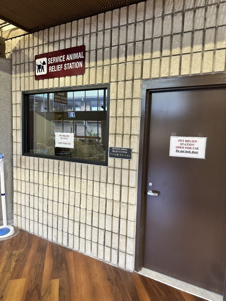 Hilo International Airport Guide (2025) | Big Island Hawai'i (ITO) Hawaii Calling a door and a sign on a brick wall