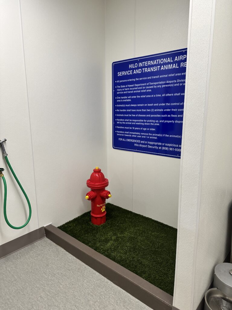 Hilo International Airport Guide (2025) | Big Island Hawai'i (ITO) Hawaii Calling a red fire hydrant in a room with a sign