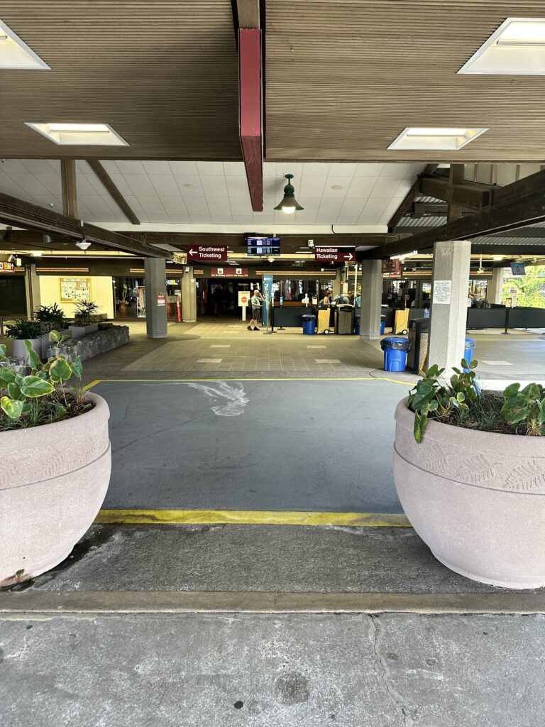 Hilo International Airport Guide (2025) | Big Island Hawai'i (ITO) Hawaii Calling two large planters in a parking lot