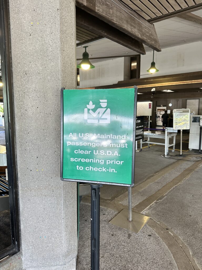 Hilo International Airport Guide (2025) | Big Island Hawai'i (ITO) Hawaii Calling a sign on a pole
