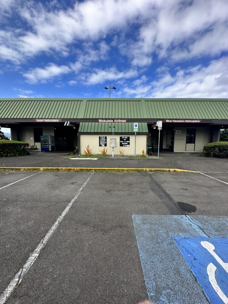 Hilo International Airport Guide (2025) | Big Island Hawai'i (ITO) Hawaii Calling a building with a green roof and a parking lot