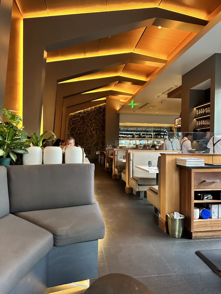 STRIPSTEAK Waikiki Review: A Sizzling Waikiki Steakhouse Experience Hawaii Calling a room with tables and chairs