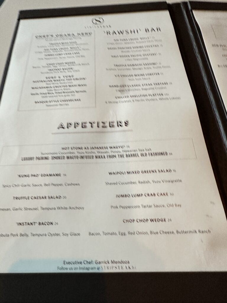 STRIPSTEAK Waikiki Review: A Sizzling Waikiki Steakhouse Experience Hawaii Calling a menu on a table