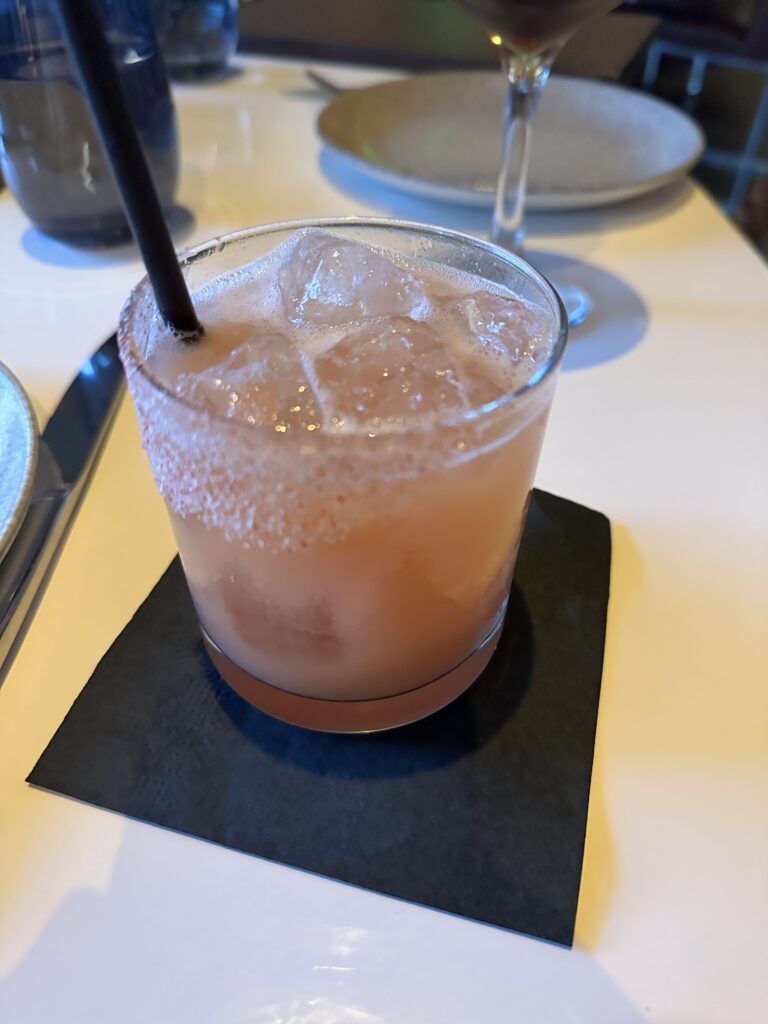 STRIPSTEAK Waikiki Review: A Sizzling Waikiki Steakhouse Experience Hawaii Calling a glass with a drink and a straw