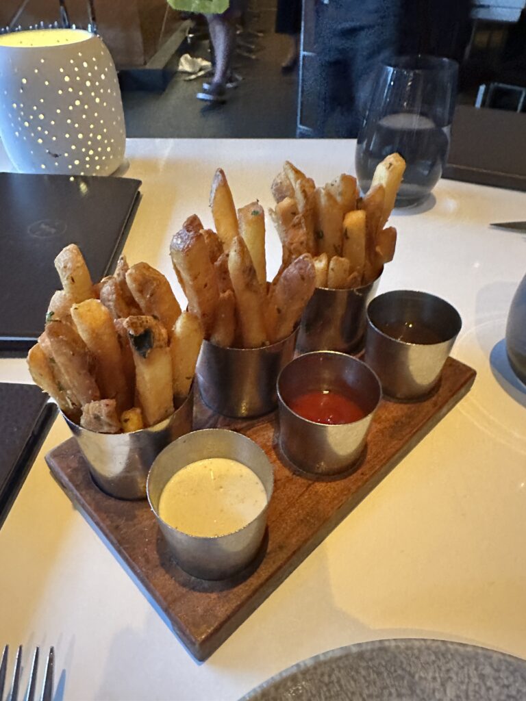 STRIPSTEAK Waikiki Review: A Sizzling Waikiki Steakhouse Experience Hawaii Calling a tray of french fries and sauces