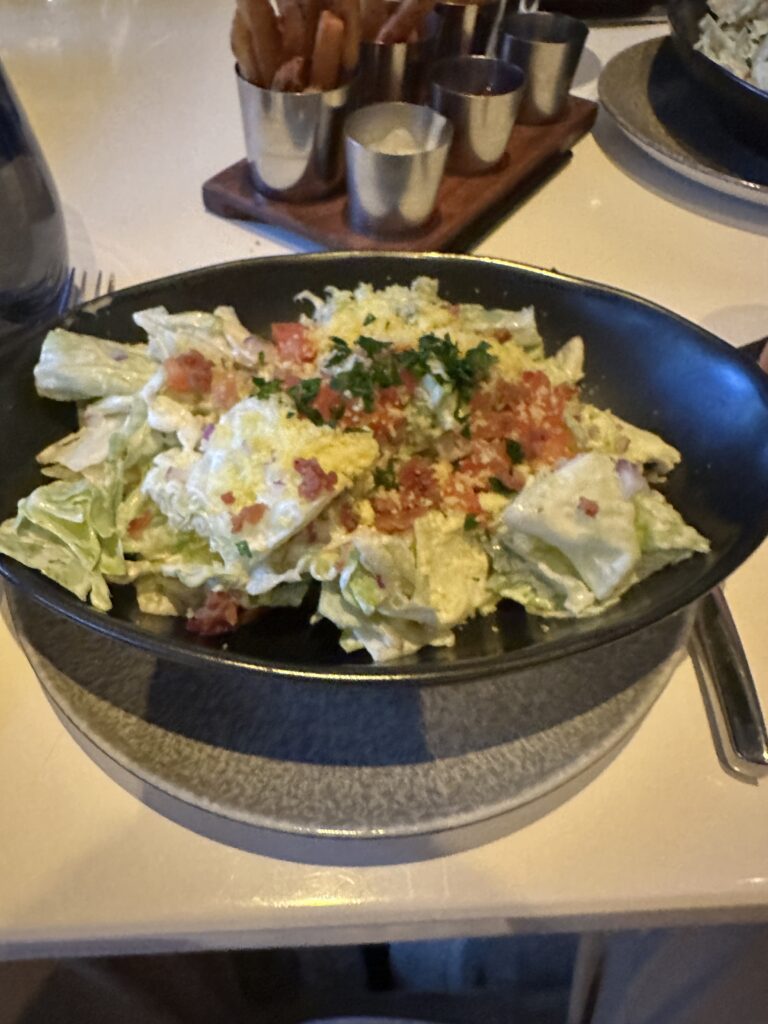 STRIPSTEAK Waikiki Review: A Sizzling Waikiki Steakhouse Experience Hawaii Calling a bowl of salad on a table