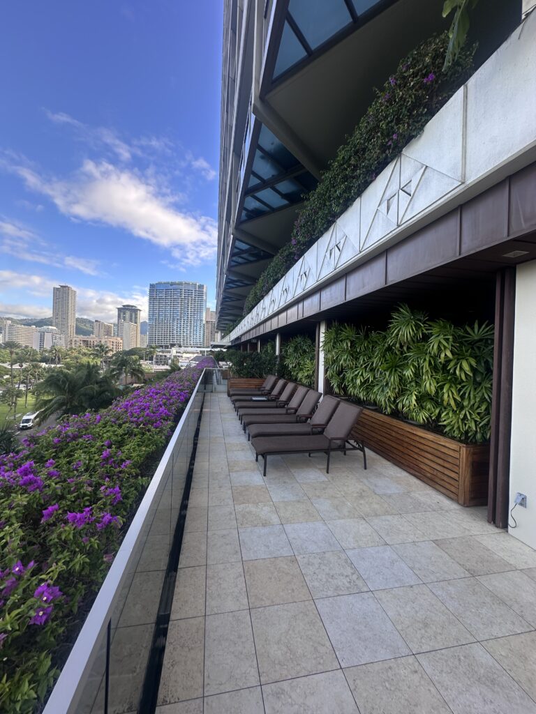 Ka La'i Waikiki Beach, A Hilton LXR Property | Review & Video Hawaii Calling chairs on a balcony with plants and flowers