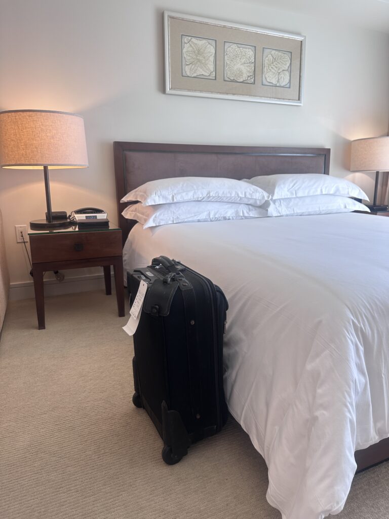 Ka La'i Waikiki Beach, A Hilton LXR Property | Review & Video Hawaii Calling a suitcase on a bed