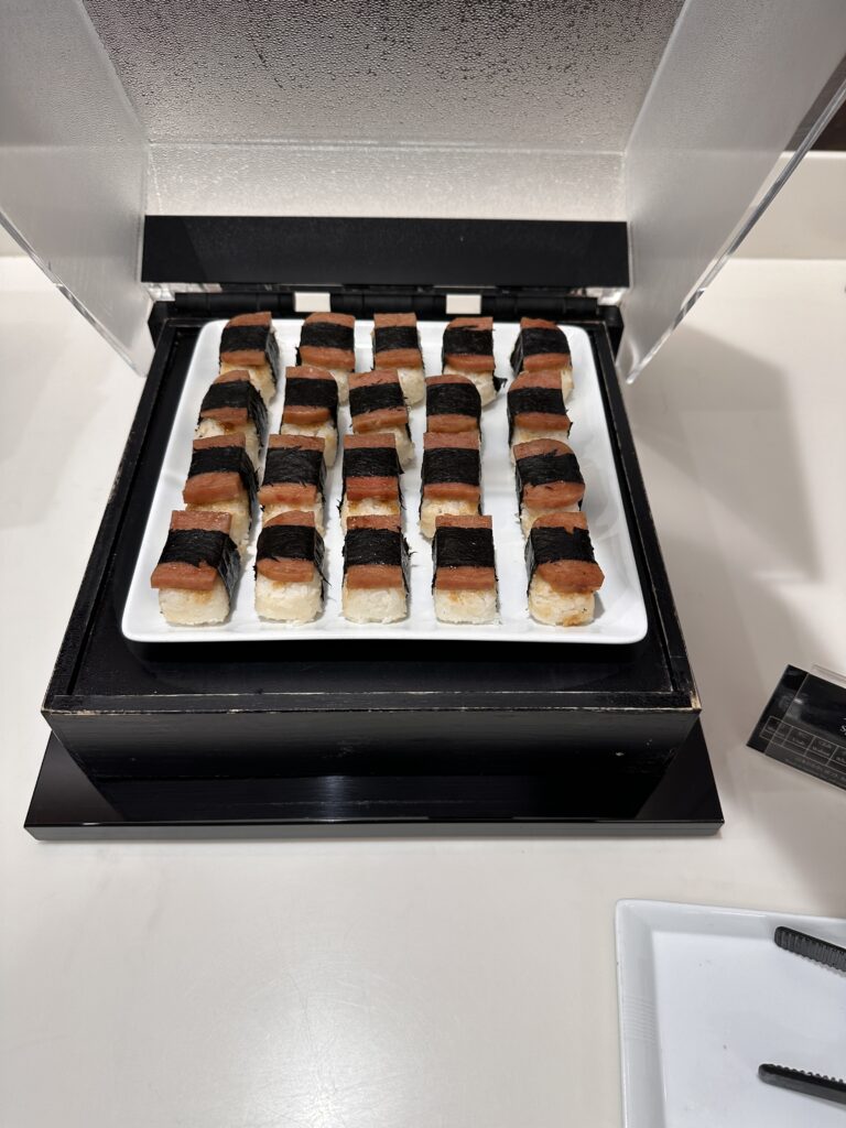 American Airlines Premium Economy Review: Honolulu (HNL) to Phoenix (PHX) on the Boeing 787-8 Hawaii Calling a tray of sushi on a table