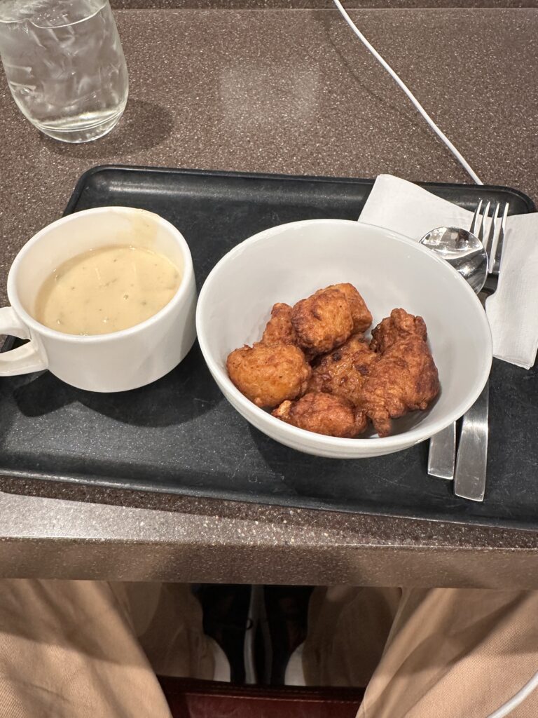 American Airlines Premium Economy Review: Honolulu (HNL) to Phoenix (PHX) on the Boeing 787-8 Hawaii Calling a tray with food and a cup of soup
