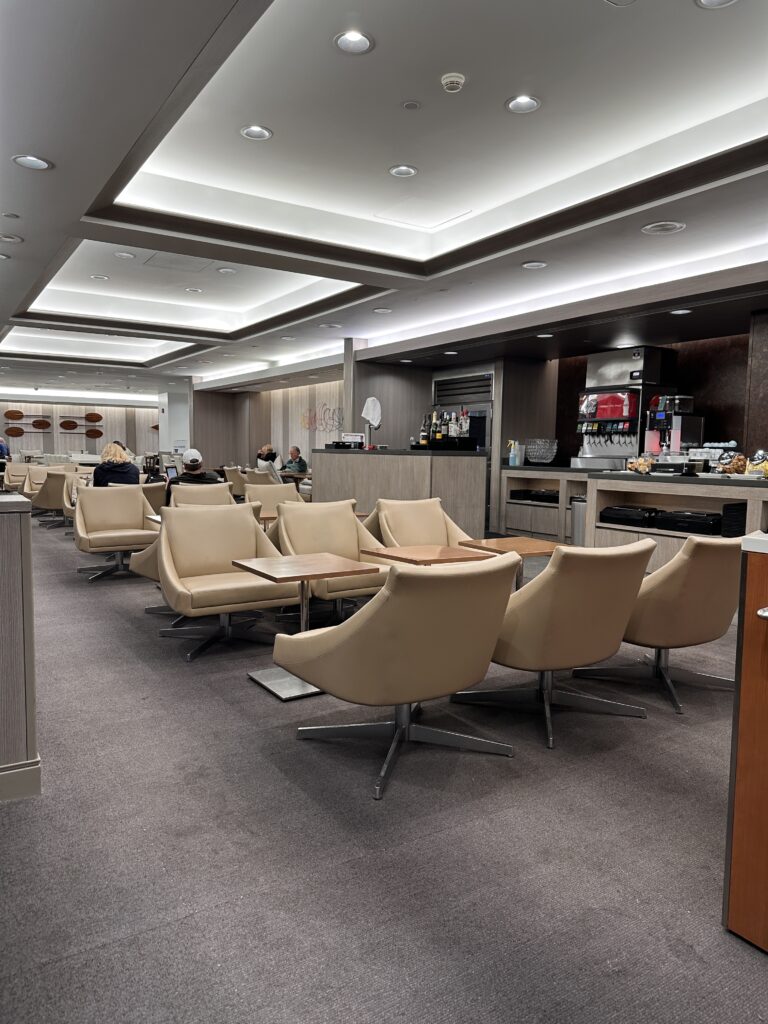 American Airlines Premium Economy Review: Honolulu (HNL) to Phoenix (PHX) on the Boeing 787-8 Hawaii Calling a room with a group of people sitting around a table