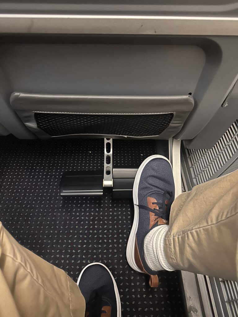 American Airlines Premium Economy Review: Honolulu (HNL) to Phoenix (PHX) on the Boeing 787-8 Hawaii Calling a person's feet in a seat