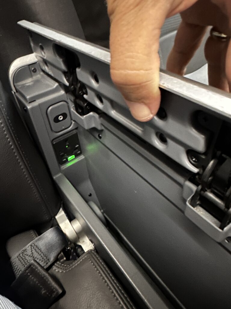 American Airlines Premium Economy Review: Honolulu (HNL) to Phoenix (PHX) on the Boeing 787-8 Hawaii Calling a person's hand holding a metal object