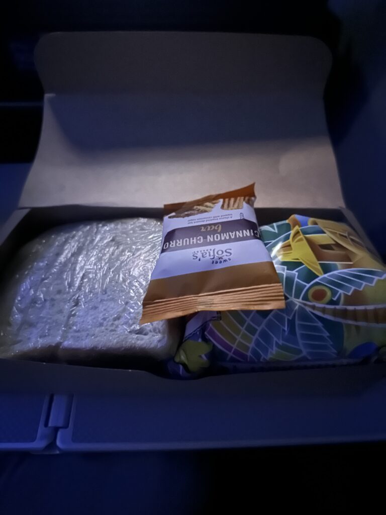 American Airlines Premium Economy Review: Honolulu (HNL) to Phoenix (PHX) on the Boeing 787-8 Hawaii Calling a box with food in it