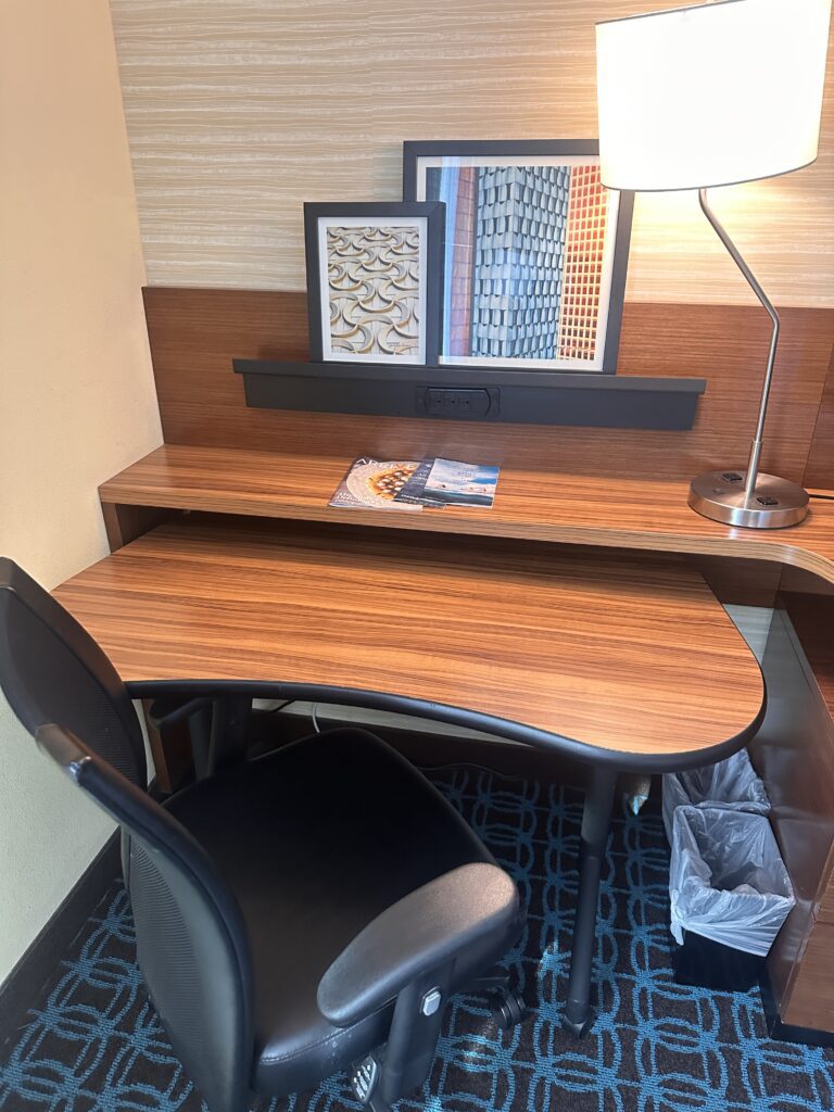 Fairfield Inn & Suites Los Angeles LAX/El Segundo | Hotel Review Hawaii Calling a desk with a lamp and a picture frame