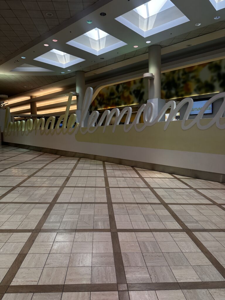 Review: American Airlines A321neo Los Angeles (LAX) - Honolulu (HNL) Economy Hawaii Calling a large sign in a building