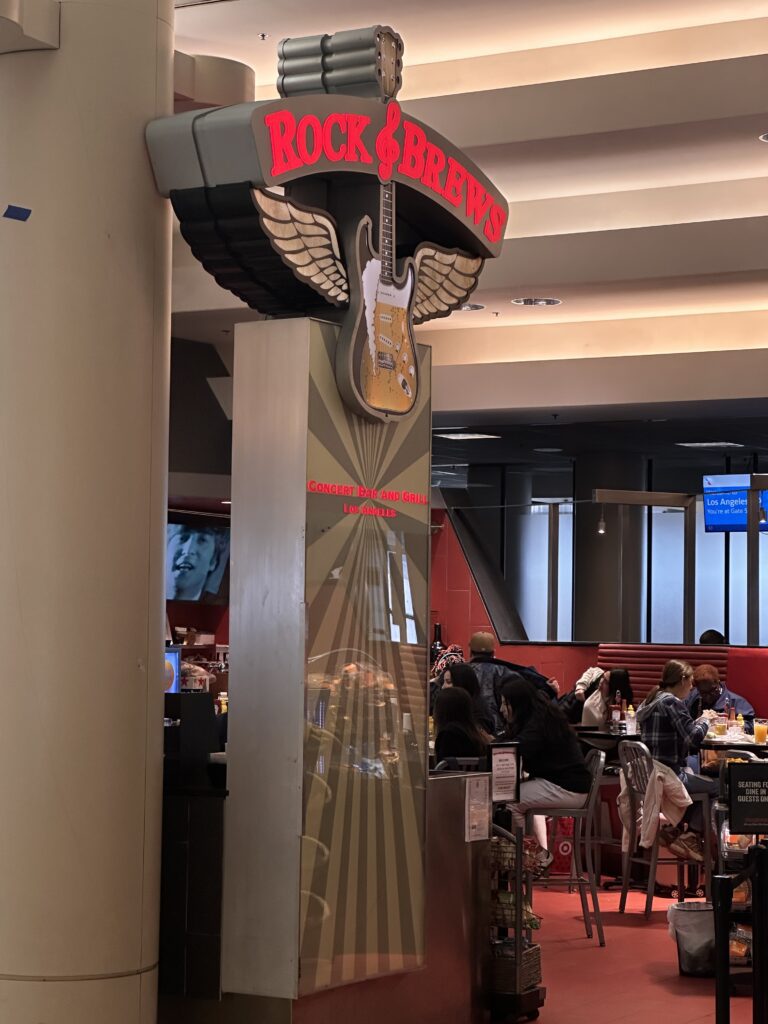 Review: American Airlines A321neo Los Angeles (LAX) - Honolulu (HNL) Economy Hawaii Calling a sign with a guitar on it