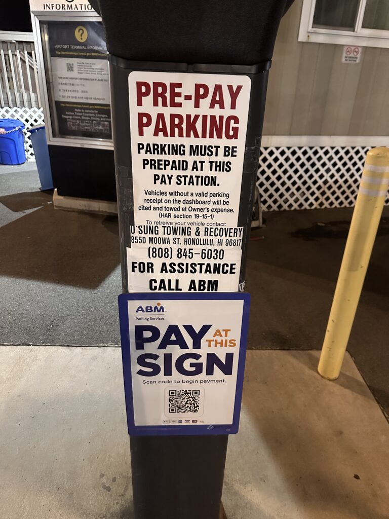 Mokulele Airlines Review: Honolulu (HNL) to Lāna‘i (LNY) | A Scenic Solo Flight Review Hawaii Calling a parking sign on a post