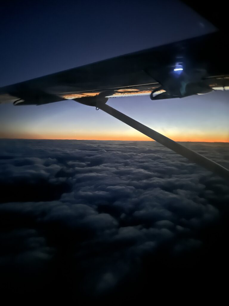 Mokulele Airlines Review: Honolulu (HNL) to Lāna‘i (LNY) | A Scenic Solo Flight Review Hawaii Calling an wing of an airplane above the clouds
