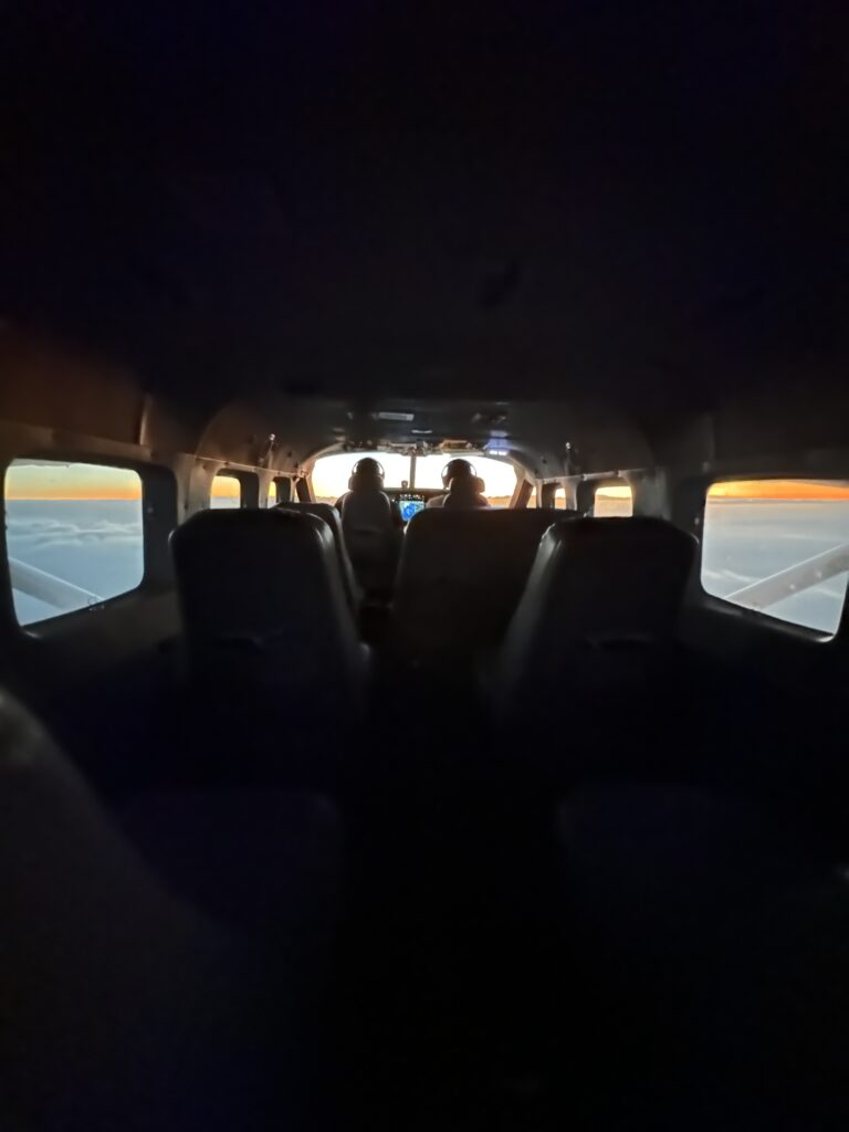 Mokulele Airlines Review: Honolulu (HNL) to Lāna‘i (LNY) | A Scenic Solo Flight Review Hawaii Calling inside a plane with people in the back