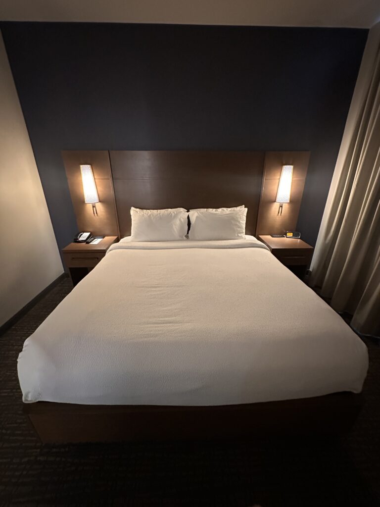 Residence Inn Oahu Kapolei: A Smart Option for Longer Stays on Oʻahu Hawaii Calling a bed with white sheets and pillows