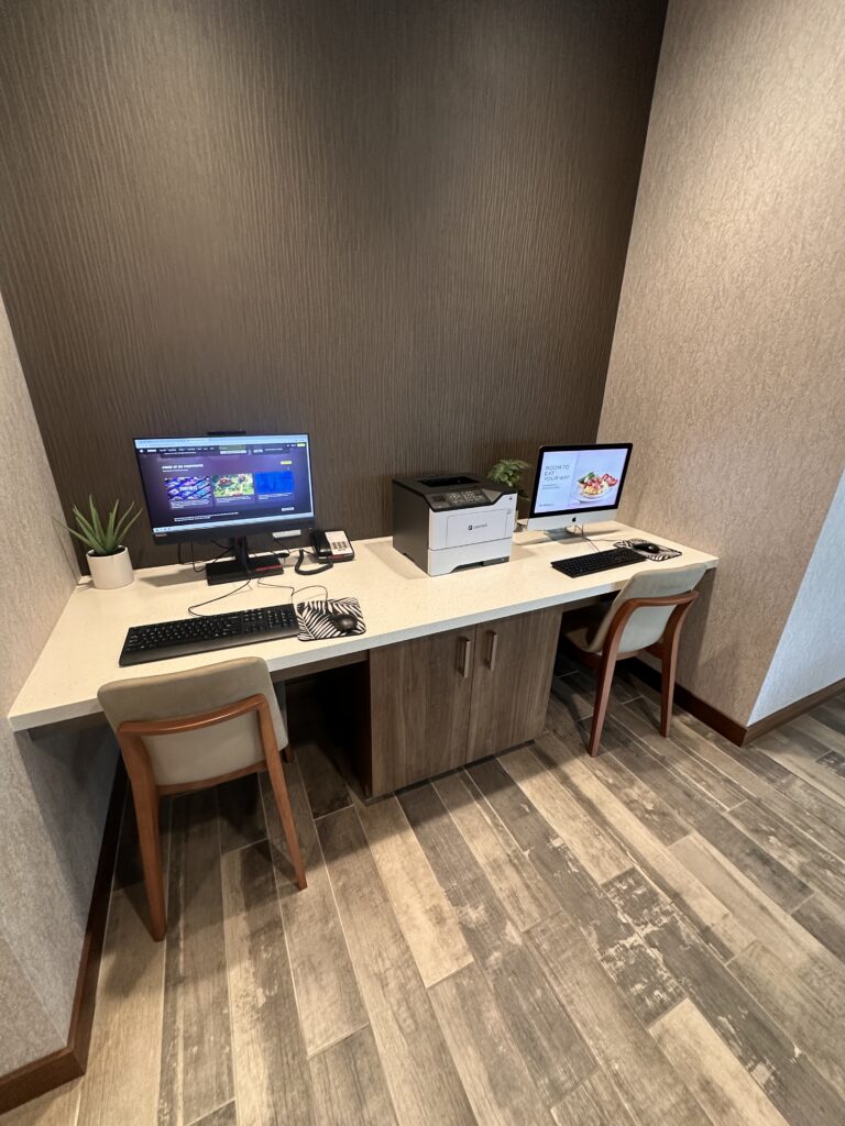 Residence Inn Oahu Kapolei: A Smart Option for Longer Stays on Oʻahu Hawaii Calling a desk with two computers and a printer