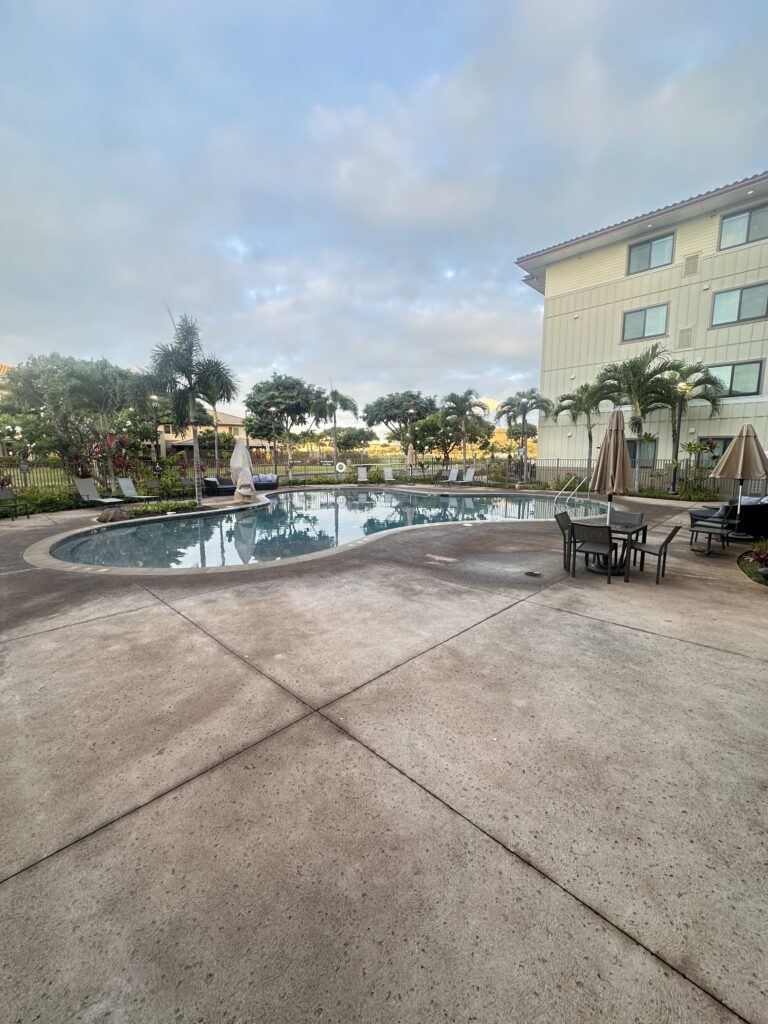 Residence Inn Oahu Kapolei: A Smart Option for Longer Stays on Oʻahu Hawaii Calling a pool with chairs and umbrellas in a hotel