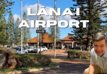 Lanai Airport Guide | (LNY) Lānaʻi Island Hawai’i a building with trees and flags
