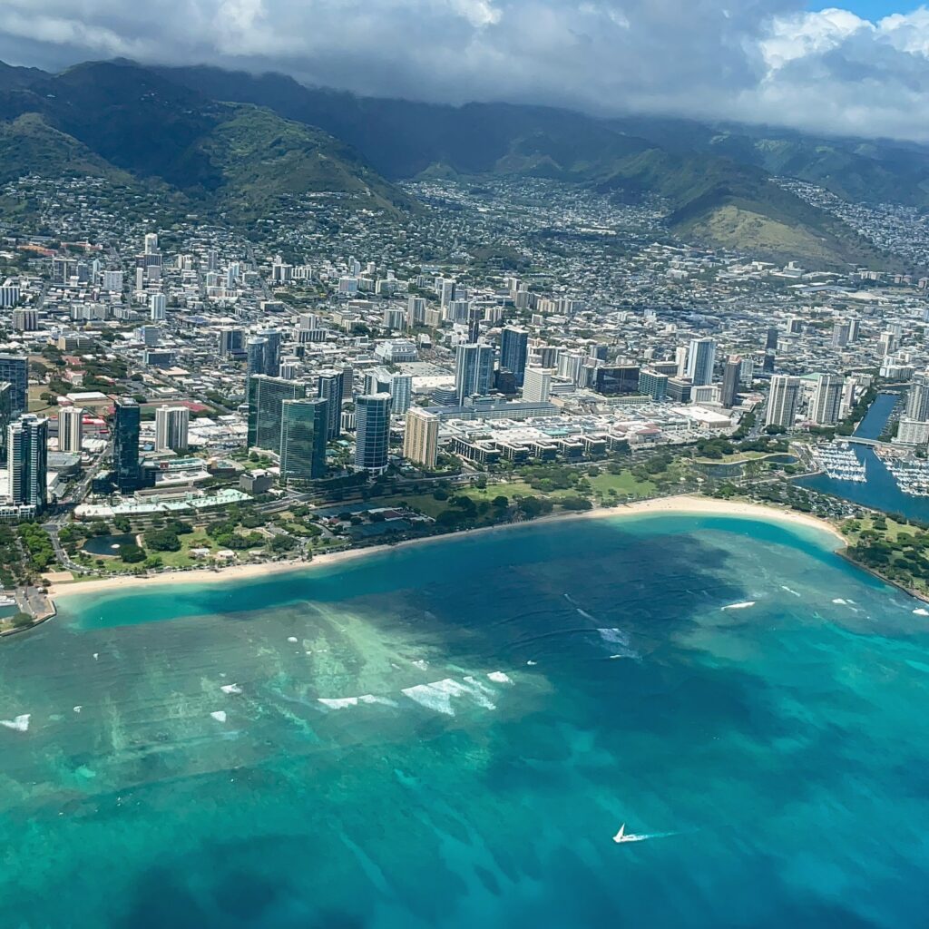 Mokulele Airlines Anniversary BOGO Sale — Island Hopping Made Better Hawaii Calling aerial view of a city and a beach