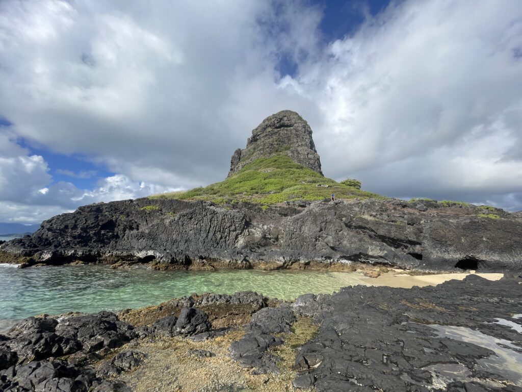 a rocky island with a large rock structure