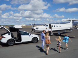 a group of people walking towards an airplane
