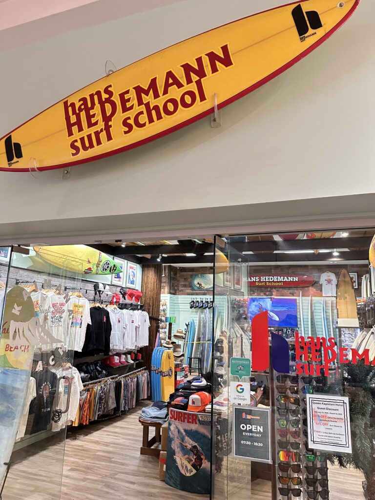 a storefront with a surfboard sign