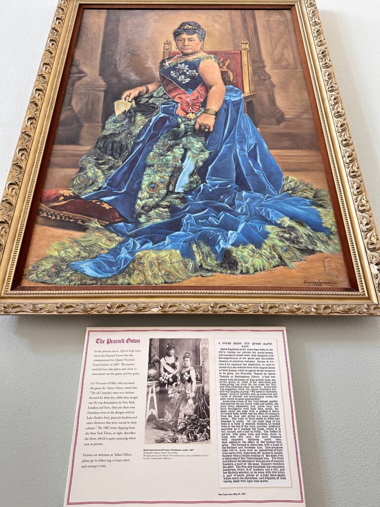 a framed picture of a woman in a blue dress