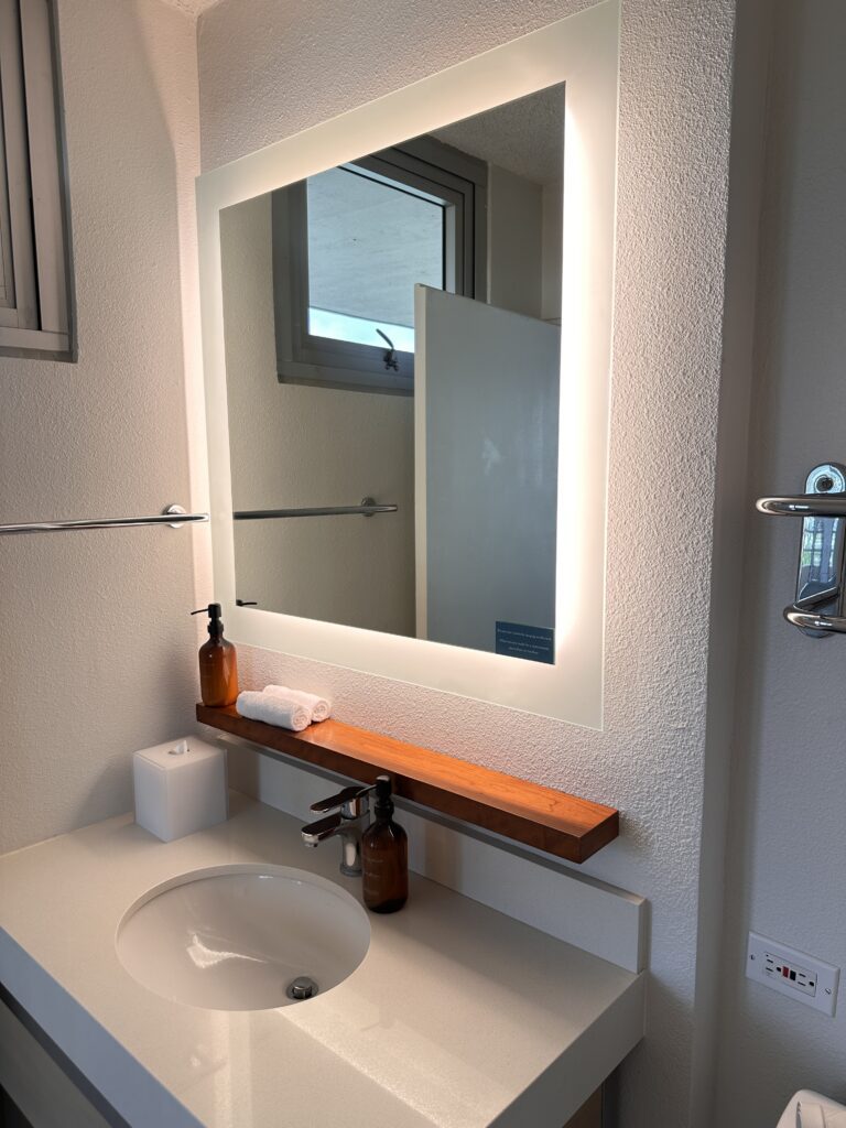 a mirror above a sink
