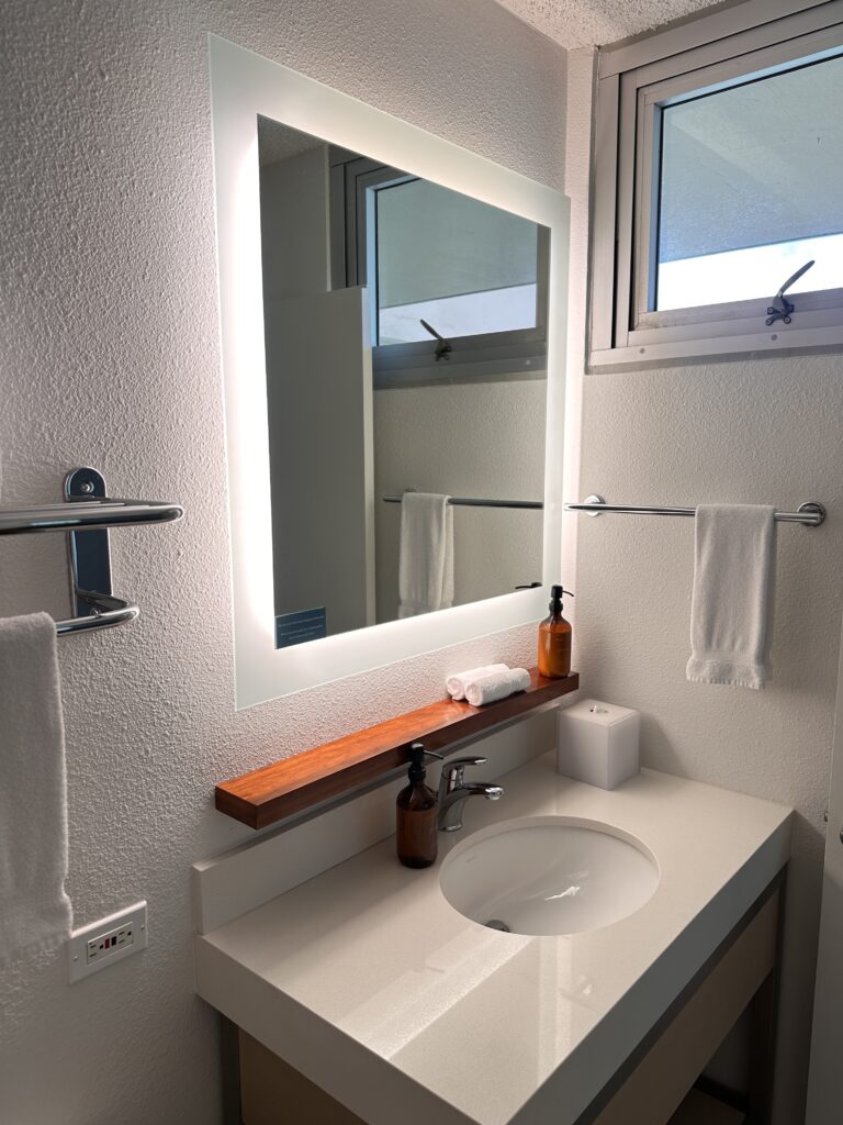 a bathroom with a mirror and sink
