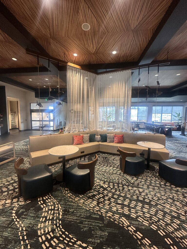 a room with a couch and chairs