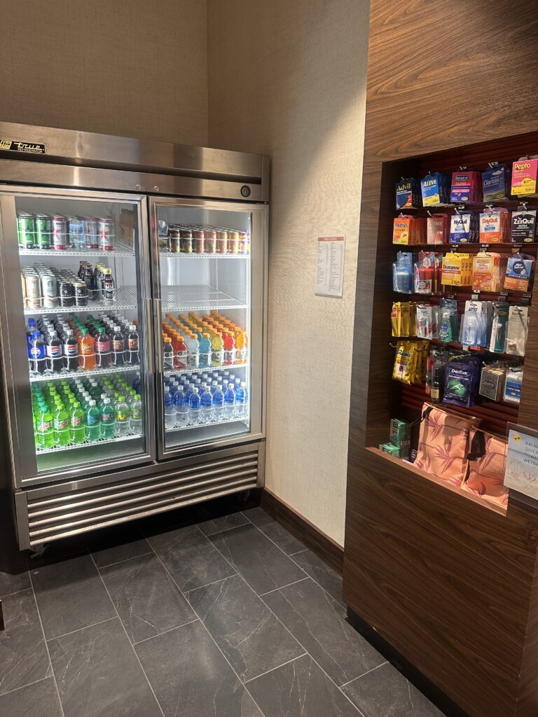 a refrigerator with drinks and beverages in it
