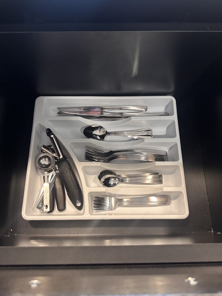 a tray of silverware in a drawer