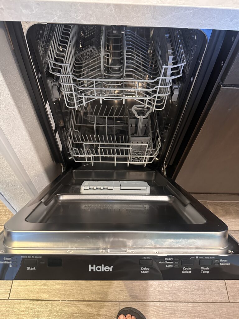 a dishwasher with a door open