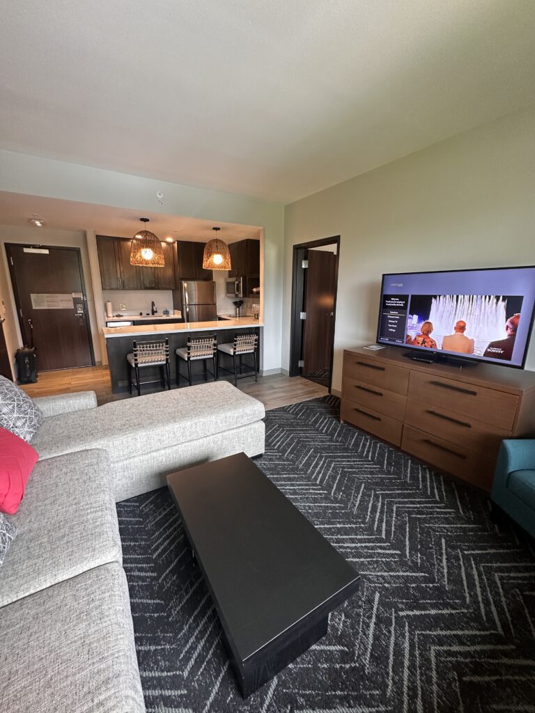 a living room with a television and a couch