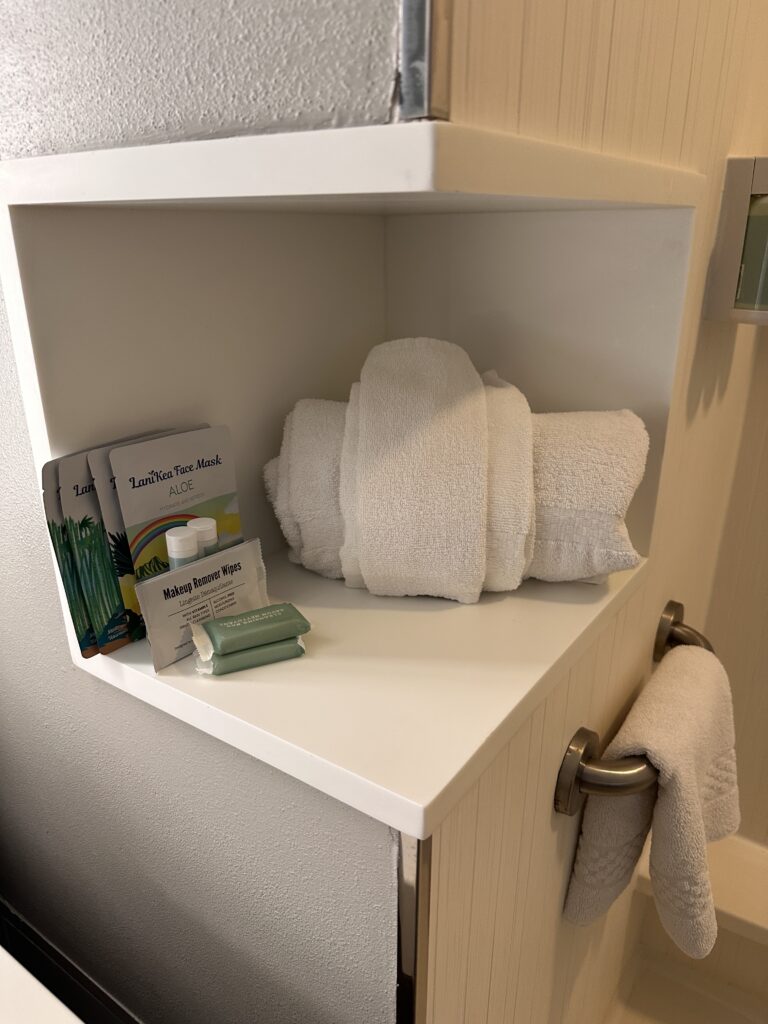 a white towel on a shelf