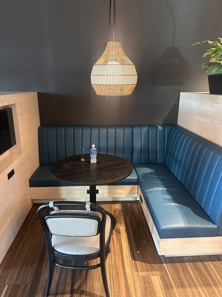 a table and chair in a booth