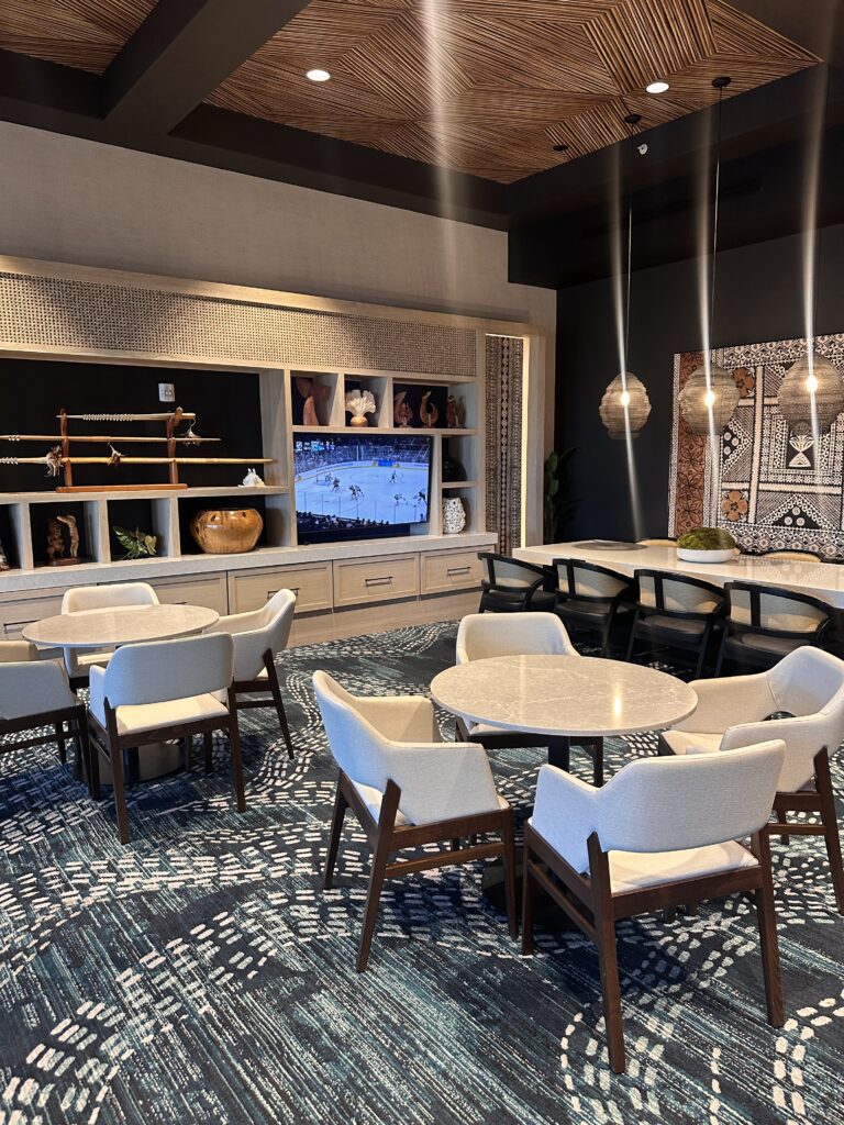 a room with a television and tables