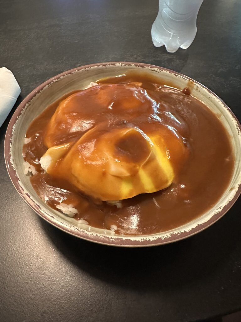 a bowl of food with brown gravy