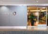 Priority Pass Is Back—Weeks After Hawaiian Airlines Marketed Premier Club as Exclusive to Local Members a building with glass doors and a sign