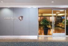Priority Pass Is Back—Weeks After Hawaiian Airlines Marketed Premier Club as Exclusive to Local Members a building with glass doors and a sign