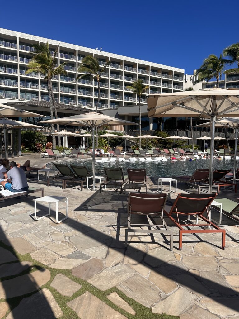 Review: The Ritz-Carlton O‘ahu, Turtle Bay — North Shore Luxury with Room to Breathe Hawaii Calling a group of people sitting on a stone surface next to a pool